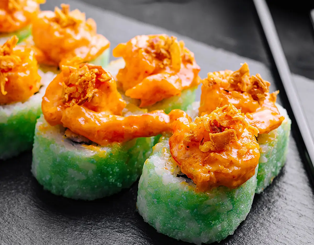 Green masago on a Spicy shrimp sushi roll