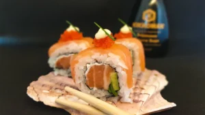 Salmon Sushi on a plate with chopsticks